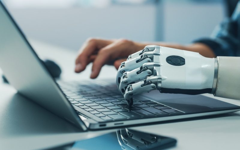 Close-up,On,Hands:,Person,With,Disability,Using,Prosthetic,Arm,To