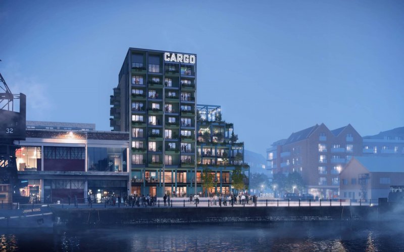 CGI CARGO building at night from across harbour
