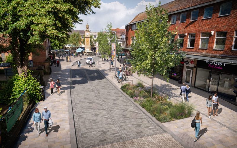 CGI of a tree-lined street with a parade of shops