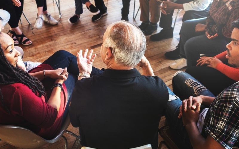 Diverse,Group,In,A,Circle,,Discussing.,People,Sharing,Ideas,,Engaging