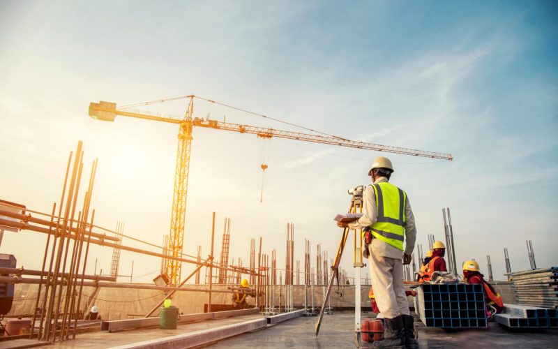 Surveyor,Builder,Engineer,With,Theodolite,Transit,Equipment,At,Construction,Site