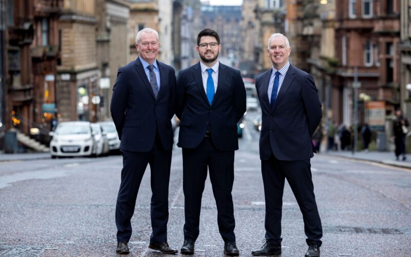DM Hall outside - left to right - John McHugh, managing partner; Charlie Barrett, partner; and Alan Gordon, senior partner