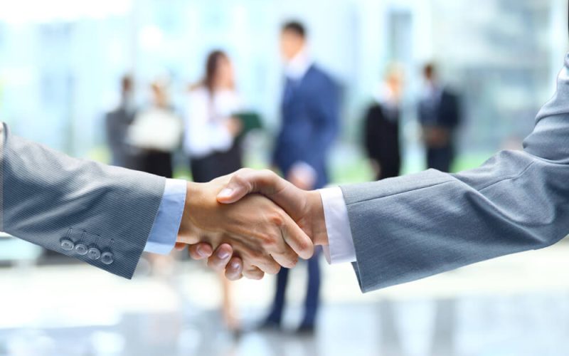 Business handshake and business people