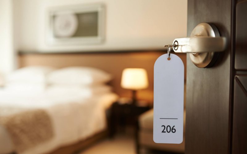 Opened,Door,Of,Hotel,Room,With,Key,In,The,Lock
