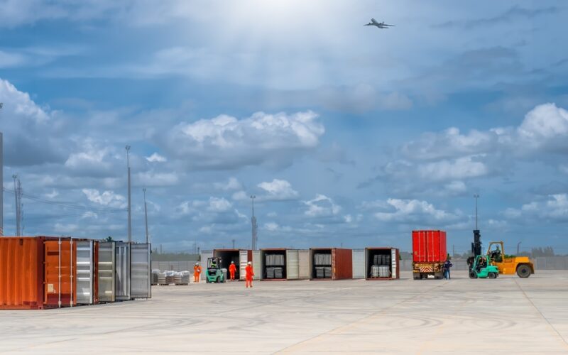 Workers,Stuffing,Cargo,Into,Containers,At,Yard,Of,Industrial,Logistic,