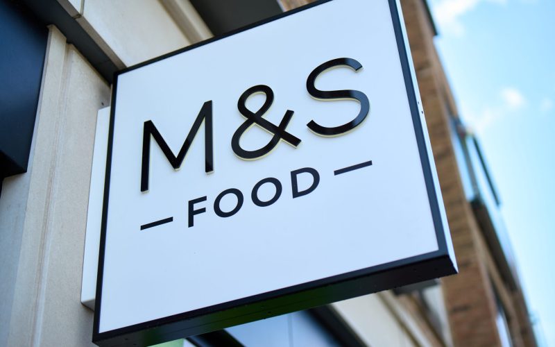 A white sign saying M&S Food