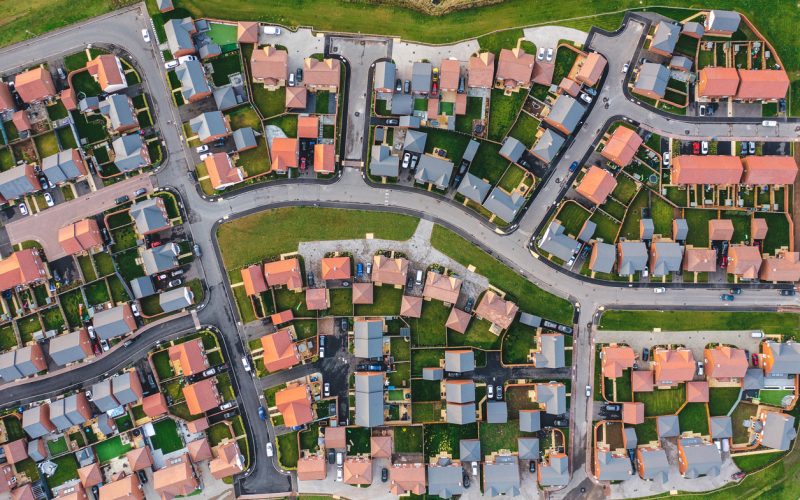Aerial top down view of houses in England - New estate with typical British houses and green gardens - Real estate and buildings concepts in UK