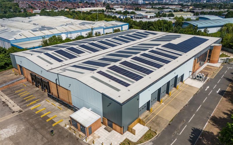 Aerial view of a large warehouse surrounded by other warehouses