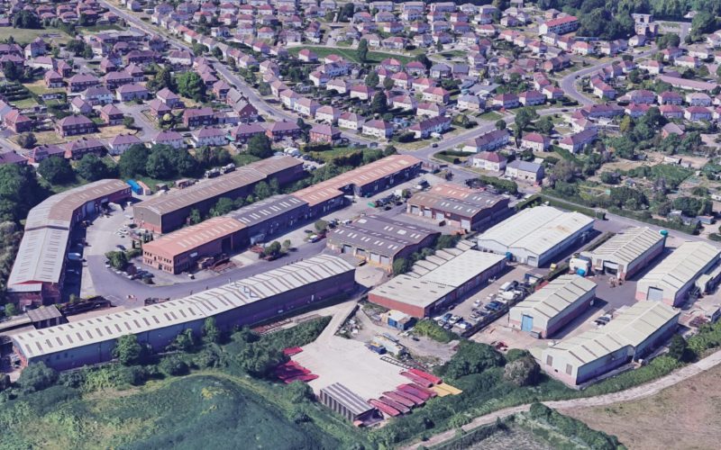 Aerial view of an industrial estate surrounded by housing