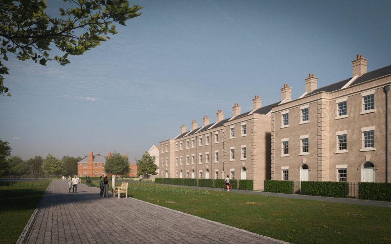 A row of brick built houses with a wide path and a lawned area in front