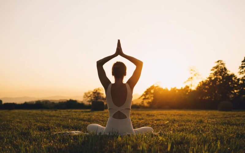 Young,Woman,Practicing,Yoga,On,Nature.,Girl,Meditating,Outdoors.,Female
