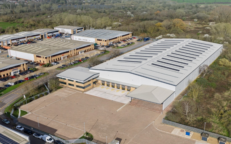 Aerial view of a large industrial unit with a yard in front