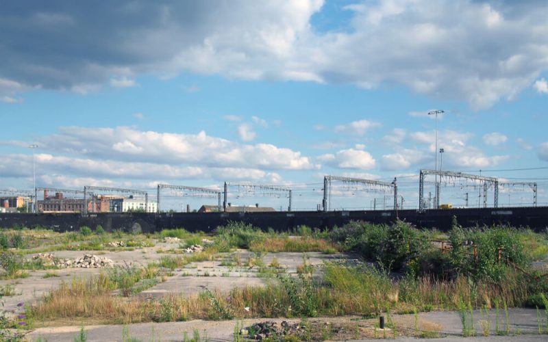 A,Large,Unused,Urban,Brownfield,Site,With,Open,Land,Covered