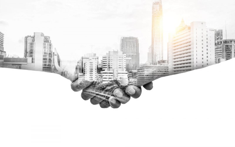Double,Exposure,Help,Hands,Shaking,Together,And,Urban,City,Representing