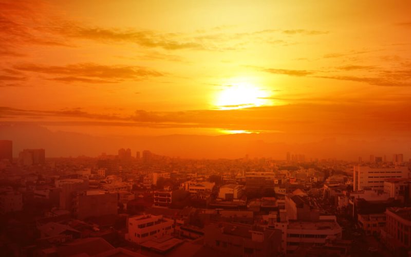 Heatwave,On,The,City,With,The,Glowing,Sun,Background.,Heatwave