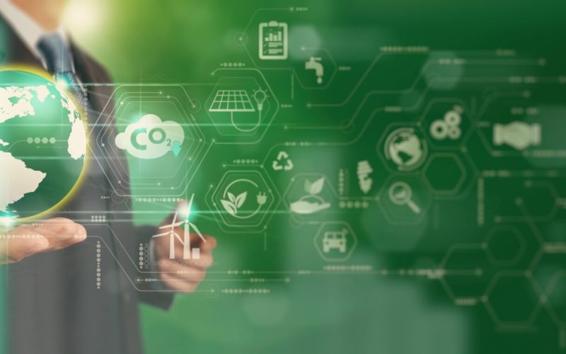 Businessman,Working,Virtual,Globe,Modern,Computer,To,Reduce,Co2,Emissions