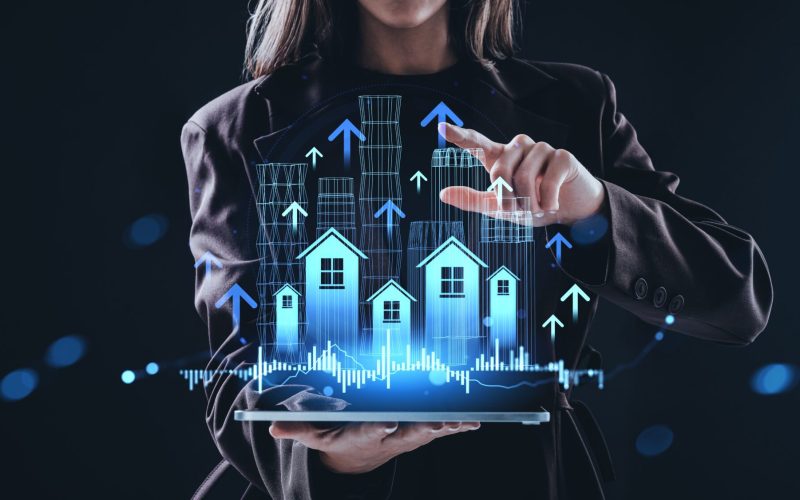 Woman,Interacting,With,Digital,Property,Data,And,Buildings,Displayed,From