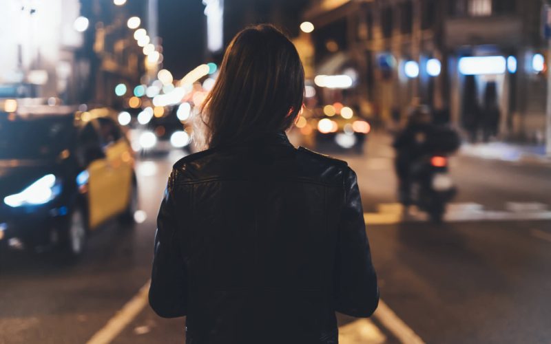 Hipster,Girl,In,Black,Leather,Jacket,From,Back,On,Background