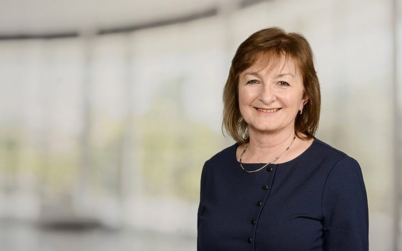 Portrait of Katrina Laud, newly appointed chair of Simply Affordable Homes, against a blurred office background