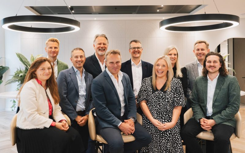 Alan Pepper, CEO of Orega, with colleagues in a modern office