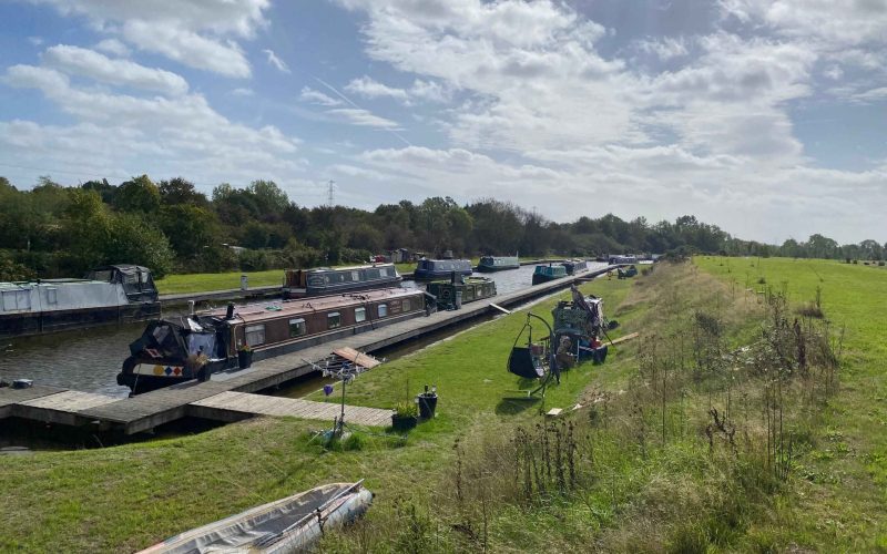 Bakers Lane Moorings, with narrowboats moored along canals in landscaped grounds.