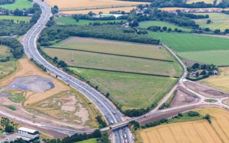 Aerial view of farmland and roads at a strategic development site near St Helens, Merseyside