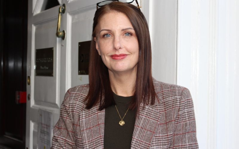 Michelle Hodgson, property management director at BTG Eddisons, stands in an office wearing a checked blazer.