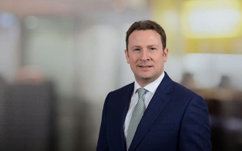 Jamie Adam, Savills’ head of residential development sales for Scotland, wearing a navy suit and tie
