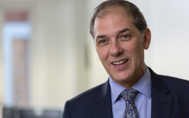 Property professional in a suit smiling for a portrait
