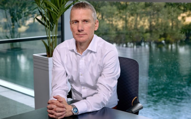 Keepmoat technical director David Major sits at a desk in a modern office.