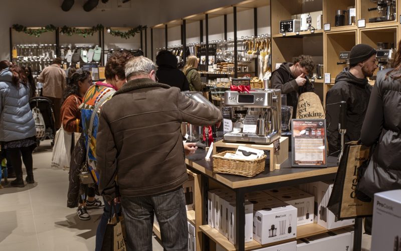 Shoppers browse cookware and kitchen accessories in a ProCook store.