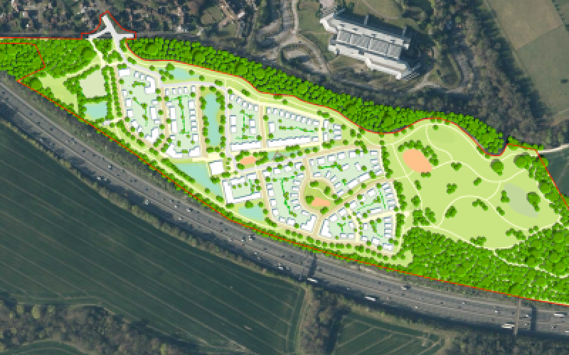 Aerial masterplan showing a proposed housing development with landscaped open space beside a major road