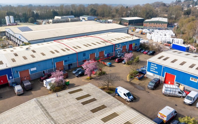 Aerial view of Britannia Business Park in Aylesford, showing commercial units, parking areas and several vehicles.