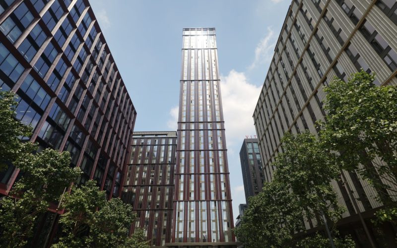 Modern high-rise buildings at Manchester’s Circle Square, viewed from street level