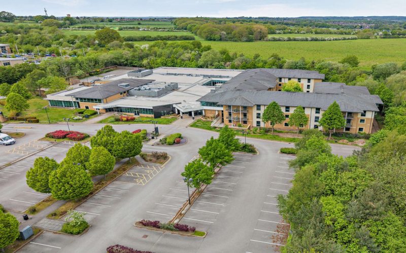 The Nottingham Belfry hotel, a modern four-storey building with a large car park and landscaped grounds.