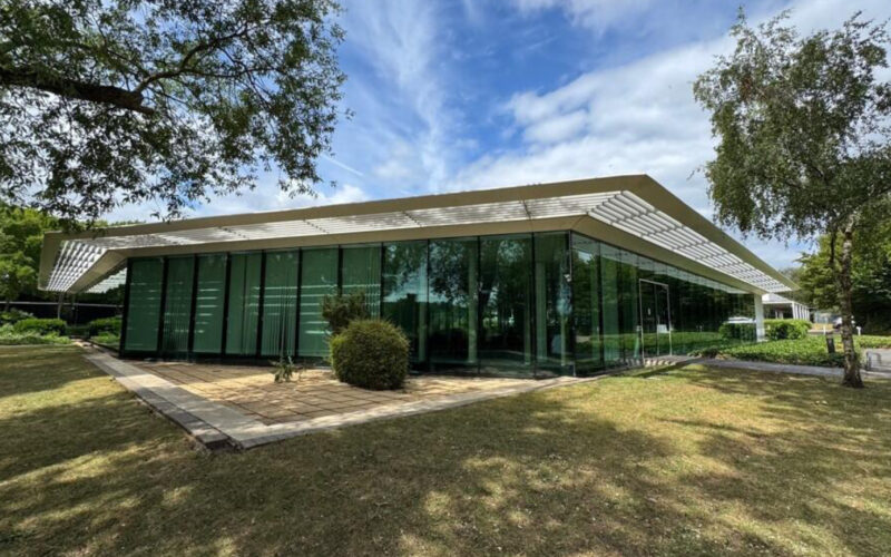2 Bramley Road, which is the new HQ of Rational UK, has a lawn area at the front and trees either side