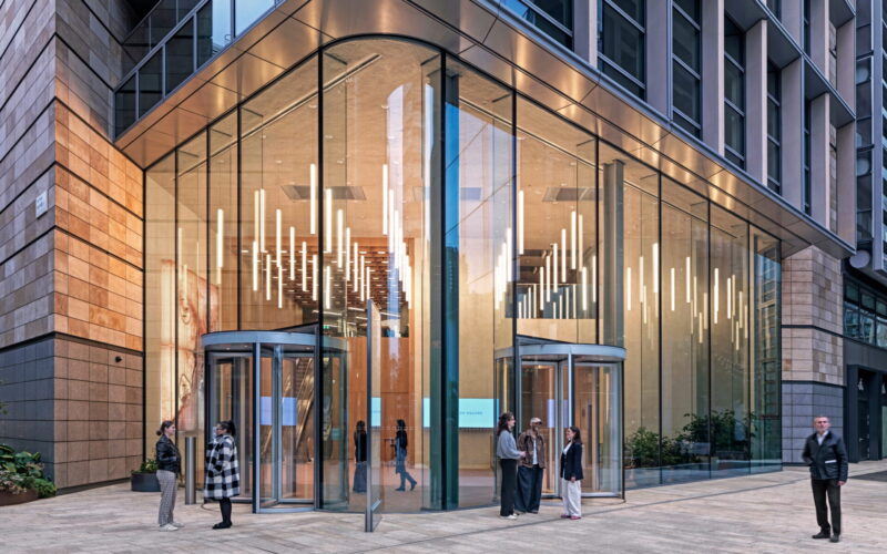 Exterior of a modern office building with a large glazed entrance area