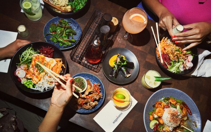 A table featuring an array of food in bowls