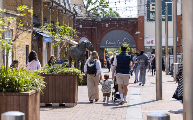 A paved area full of pedestrians