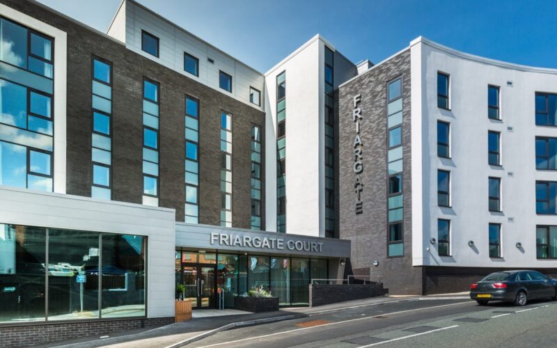 Exterior of a low rise student accommodation building on a main road