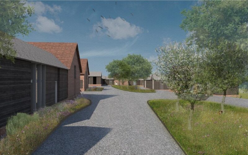 Artist's impression of a housing development with homes lining the left hand side next to a wide footpath and greenery