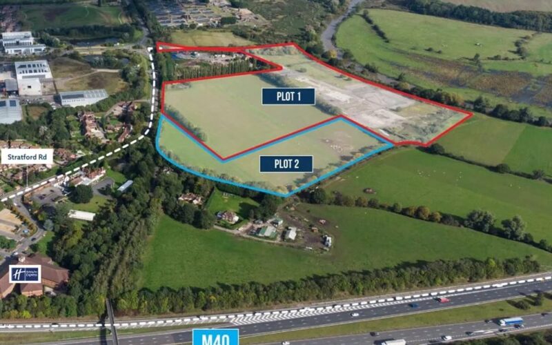 Aerial view of a 29-acre development site opposite Tournament Fields Business Park in Warwick purchased by PLP with the sites outlined in red and blue