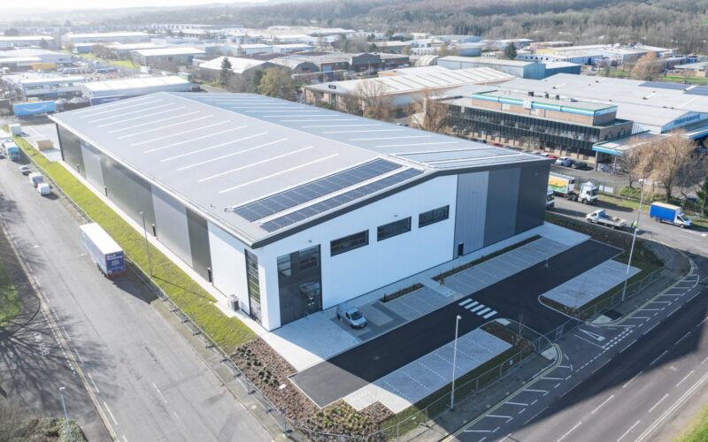 A large grey and white industrial unit at Team Valley business estate with car parking to the front of the building