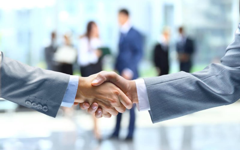 Business handshake and business people