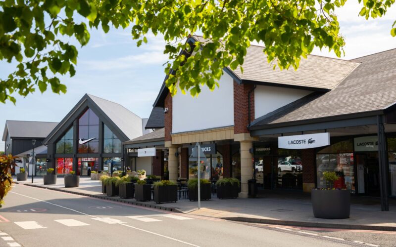Exterior of a row of retail outlets at the East Midlands Designer Outlet