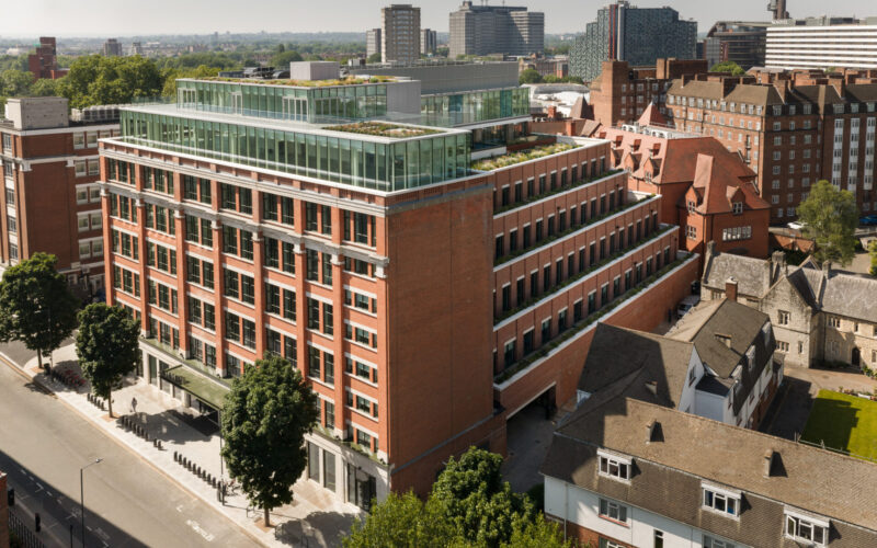 CGI of a brick built office building with a glass roof extension