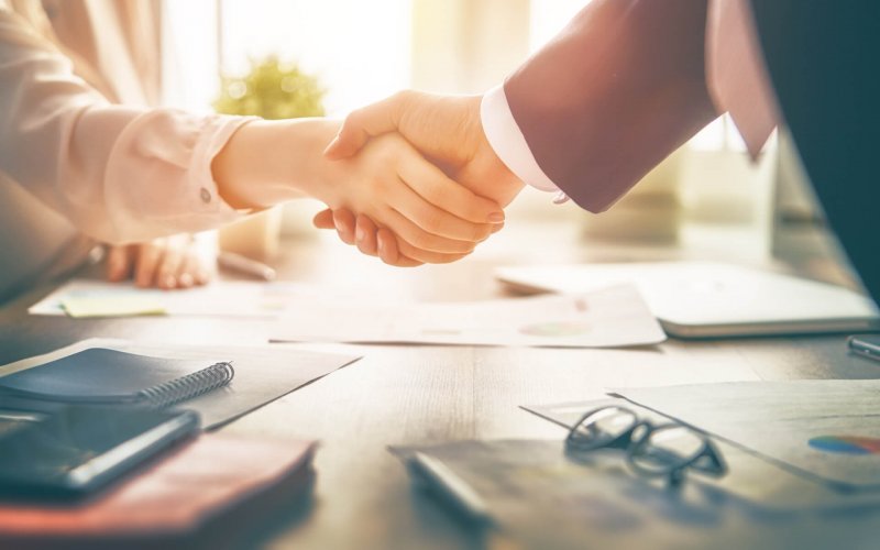 Man,And,Woman,Are,Shaking,Hands,In,Office.,Collaborative,Teamwork.