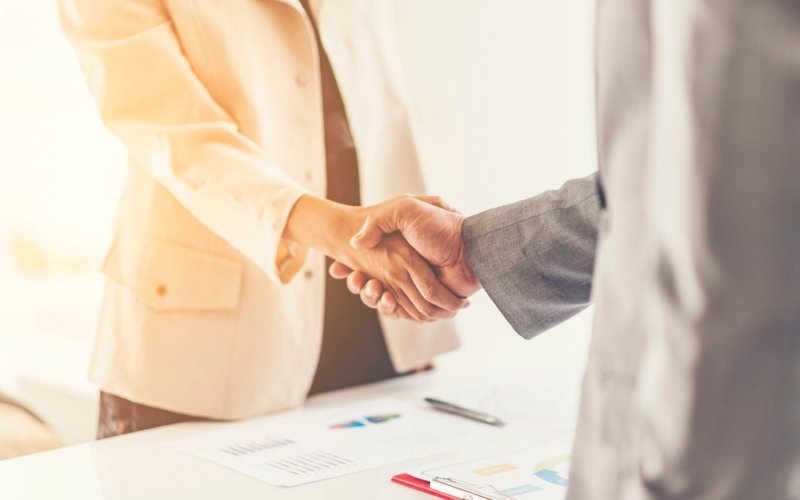 Two,Confident,Business,Man,Shaking,Hands,During,A,Meeting,In