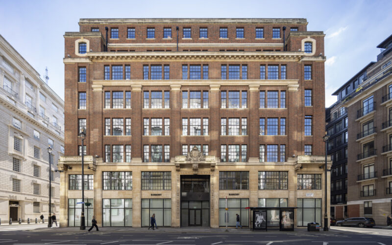 Historic multi-storey building featuring a series of windows on its facade