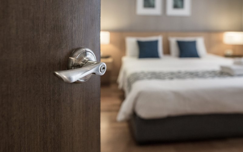 Hotel,Room,,,Condominium,Or,Apartment,Doorway,With,Open,Door